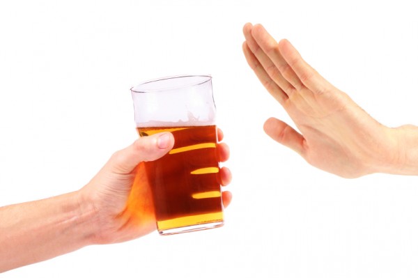 hand reject a glass of beer